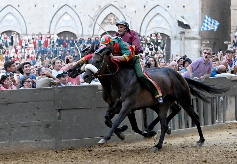 Jockey Giovanni Atzeni, called Tittia, who mounted Zio Frac, won the Palio di Siena, Italy, 02 July 2022. After two years of stop for the pandemic, it was won by the Dragon at the photo finish with the Tower. Atzeni is on his eighth victory.  ANSA / Claudio Giovannini