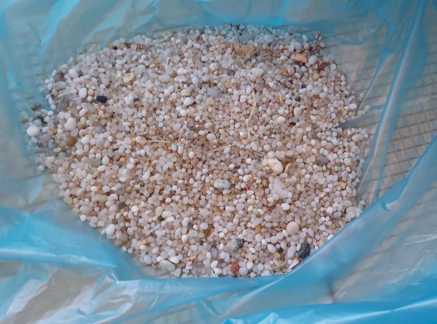 
	Sabbia recuperata dagli operatori all'interno dell'Amp

