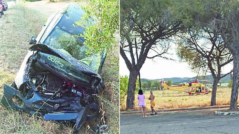 A sinistra l’auto incidentata e a destra l’elicottero Pegaso atterrato nel campo a bordo strada