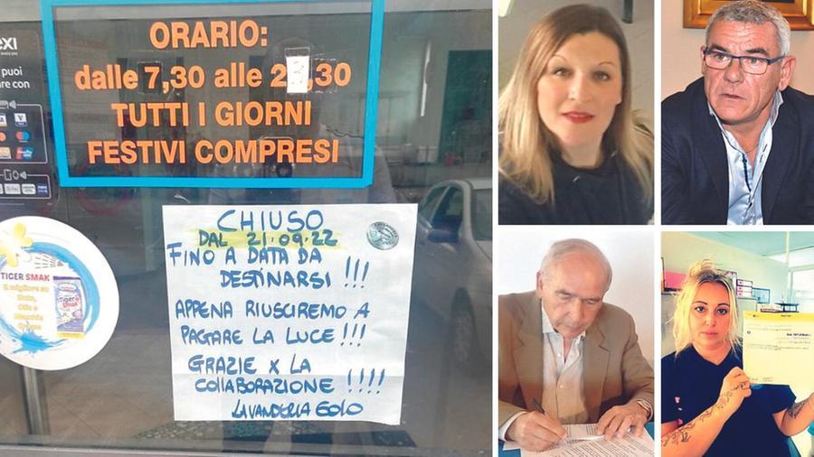Il cartello esposto da una lavanderia ad Aulla; a destra dall’alto in senso orario Michela Testa, Mauro Squarcia, Kathy Cazzuola e Mauro Sola (sono 4 titolari di attività)