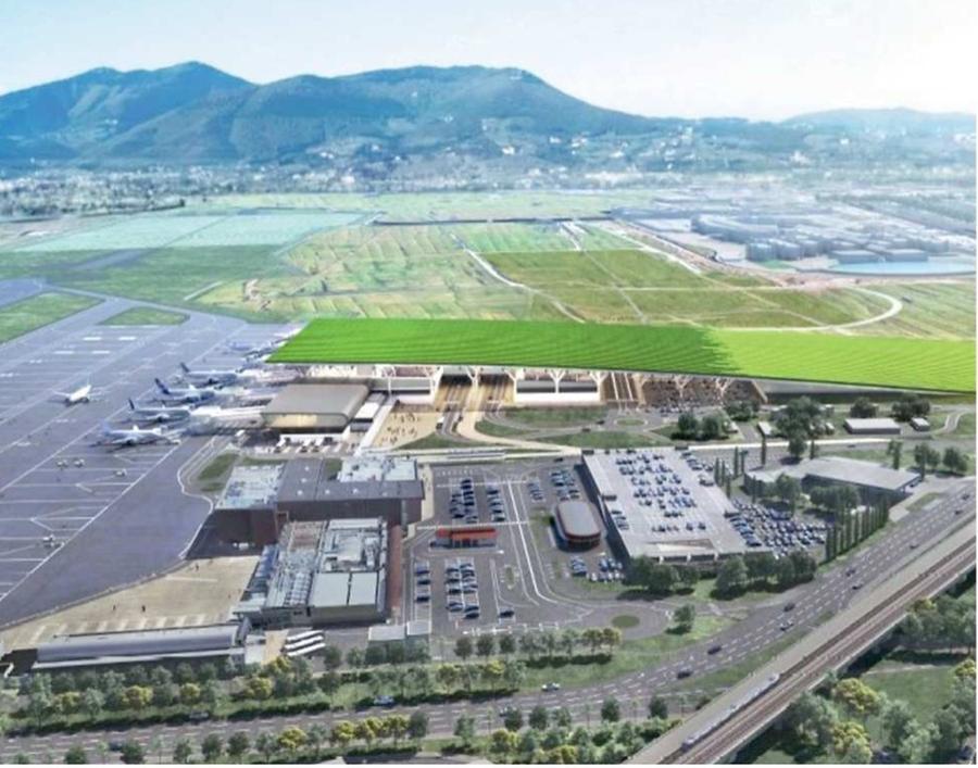 
	Una vista del nuovo terminal e della nuova pista; a destra, l&rsquo;ingresso avveniristico al nuovo terminal passeggerI

