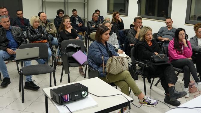 Nella foto un incontro con i commercianti