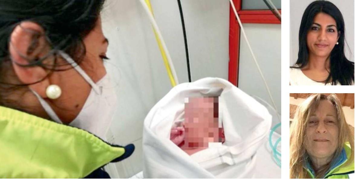 Il maschietto nato in ambulanza in braccio al medico del 118 e a lato la dottoressa Mary e la volontaria della Misericordia di Piombino Lucia Taddei