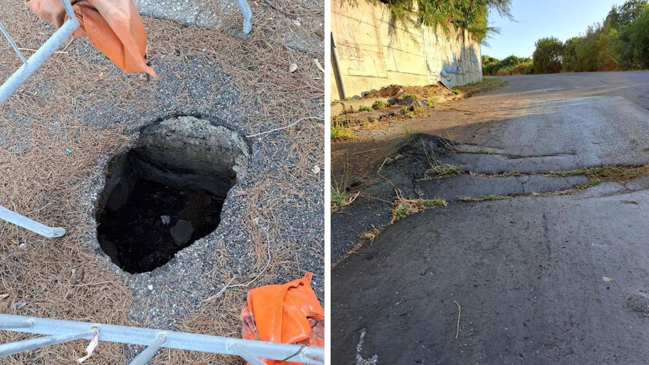 L’impressionante buca in via delle Spianate (presente da 4 anni secondo alcuni residenti) e, a destra, il cedimento stradale e il marciapiede rialzato al termine di via Arno