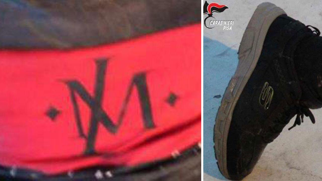 Due dettagli della maglia e di una scarpa del cadavere