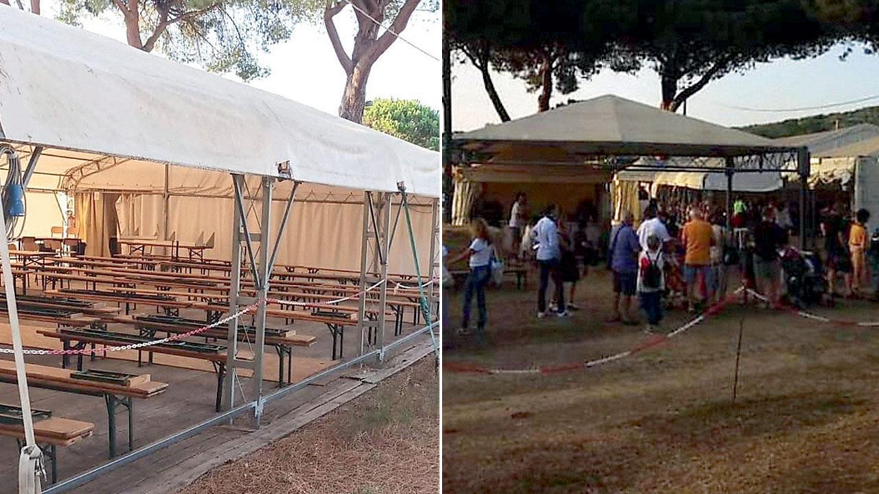Nella foto la struttura della Festa “spogliata” del tendone laterale e avventori tra gli stand della Festa (da una foto dal profilo Facebook)