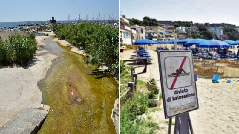 Il tratto finale del Rio Salivoli e a destra il cartello che avvisa del divieto di balneazione temporaneo nel golfetto (foto Paolo Barlettani)