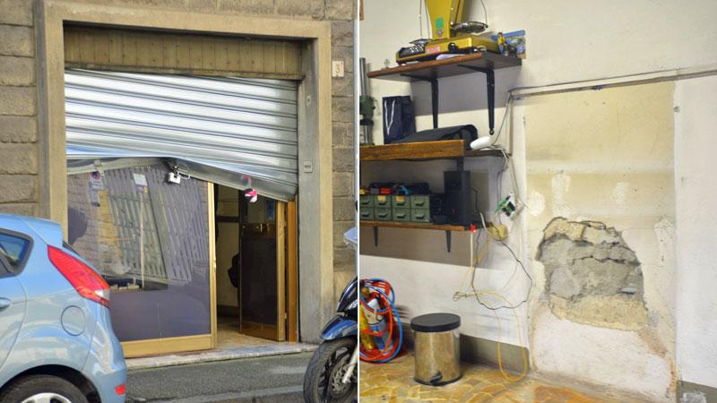 La serranda del laboratorio piegata e a destra il “buco” nel muro dove era installata la cassaforte rubata