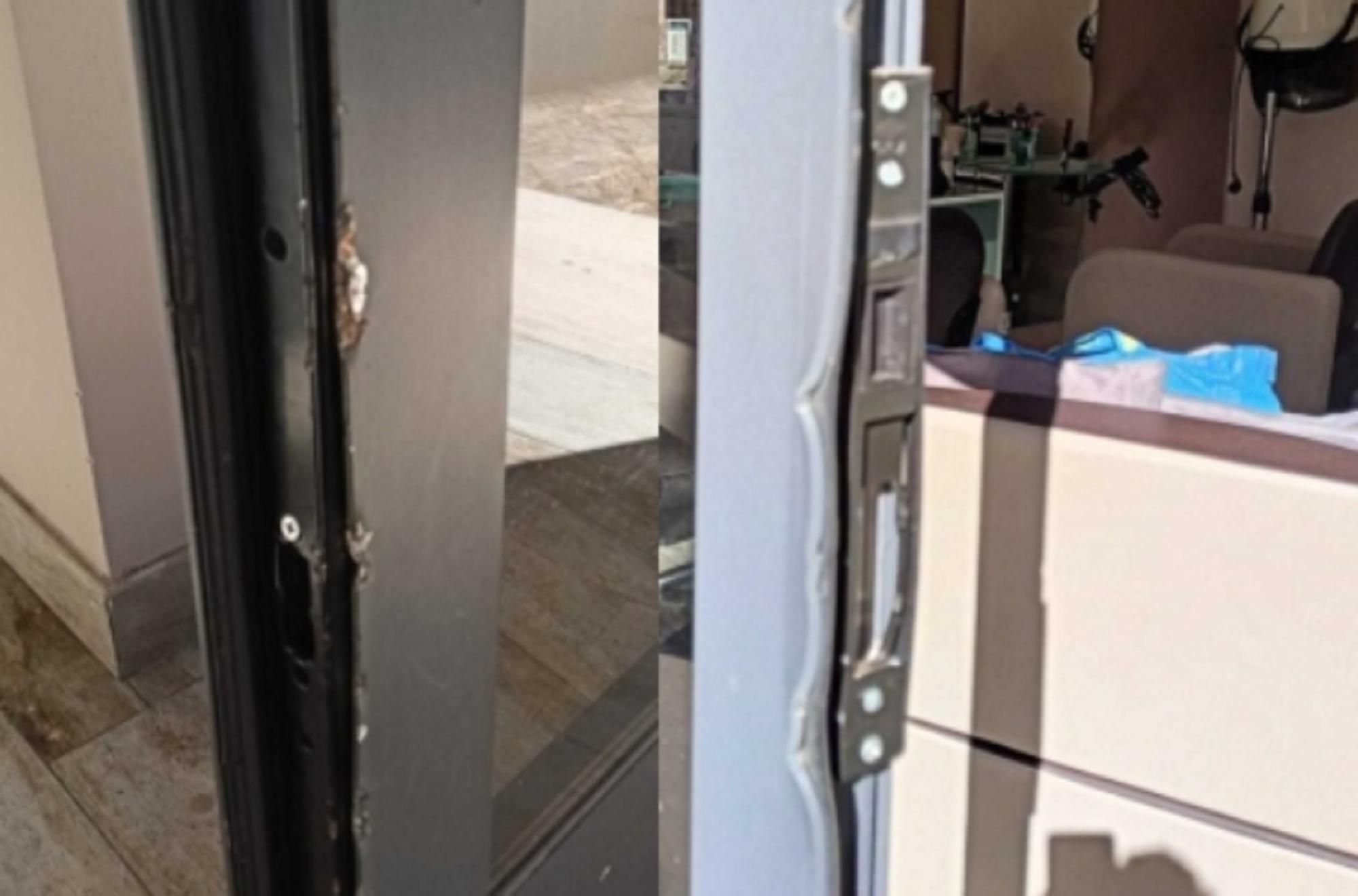 I danni alla porta d'ingresso di "Roberta Studio" in via Accademia labronica