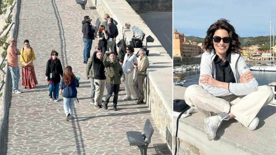 
	La troupe &nbsp;al molo di Rio Marina impegnata nelle riprese e, a destra, Anna Valle, durante una pausa (foto Gio&rsquo; Di Stefano)


