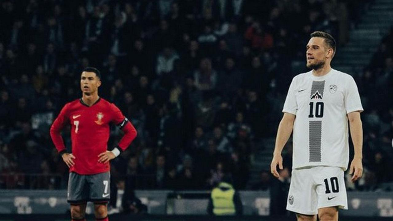 
	Elsnik&nbsp;con Cristiano Ronaldo in una sfida tra Slovenia e Portogallo

