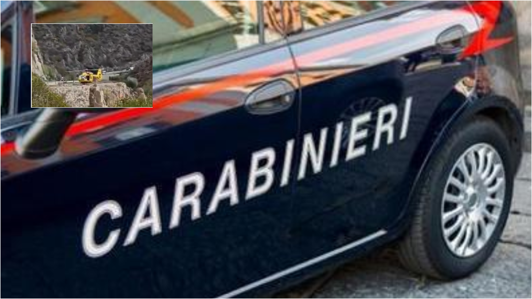 Un'auto dei carabinieri e il punto in cui è avvenuto l'incidente 