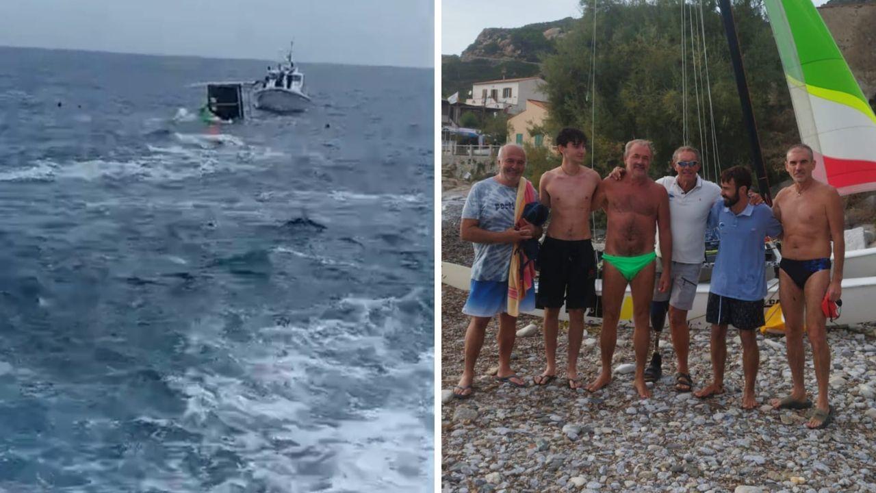 Il catamarano ribaltato e alcuni protagonisti del salvataggio: da sinistra Antonio Goia, Gianlorenzo Soldi, Pierluigi Costa, Lionel Cardin, Remi Guichard e Gianluigi Soldi