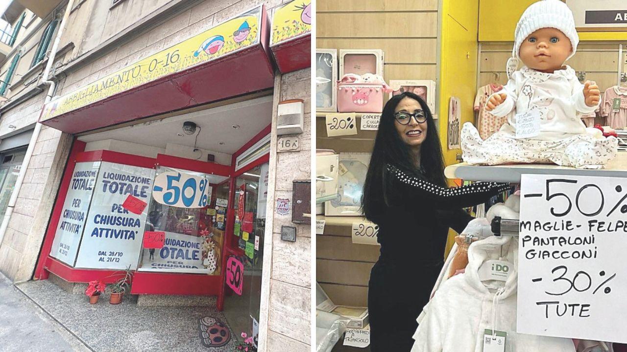 I cartelli della svendita coprono le vetrine di Miki Kids e la titolare Michela Ciucci in negozio