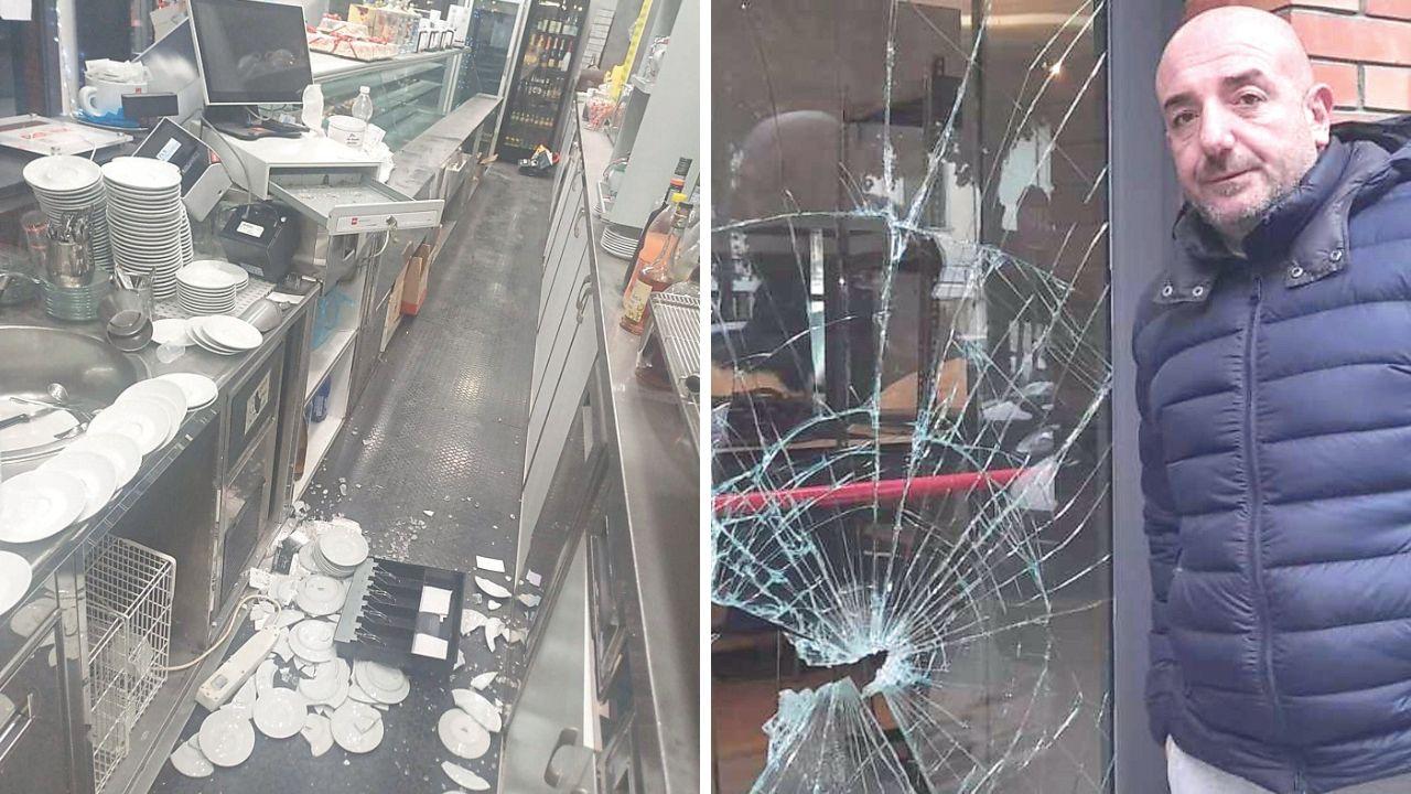 Emanuele Santini mostra la vetrata spaccata e a sinistra la cassa