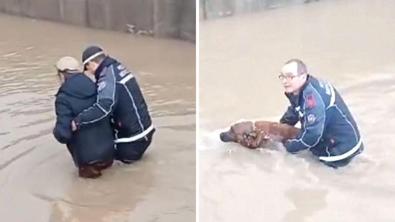 L'agente Davide Franchi mette in salvo l’uomo rimasto intrappolato nel sottopasso, a destra l’agente Marco Venturini che aiuta il cane