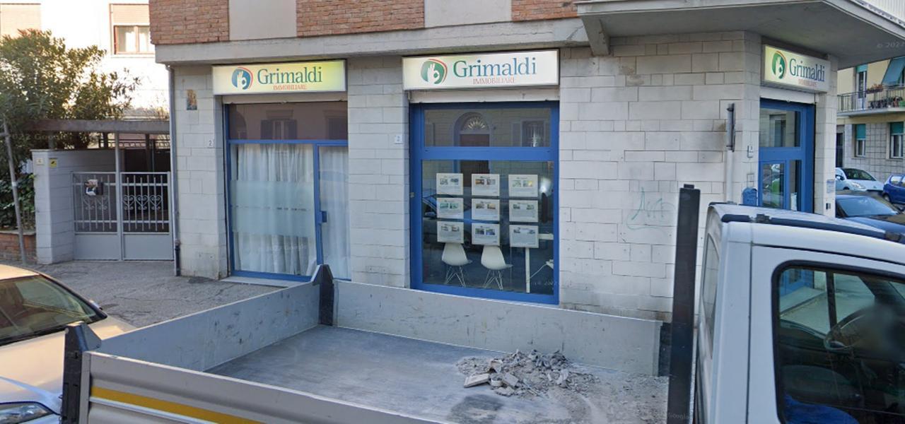 
	L'agenzia immobiliare Grimaldi

