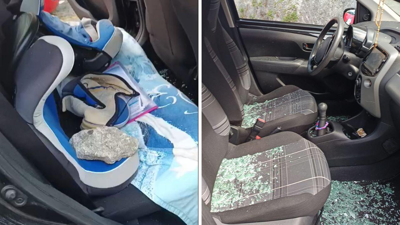 L'auto devastata con un masso