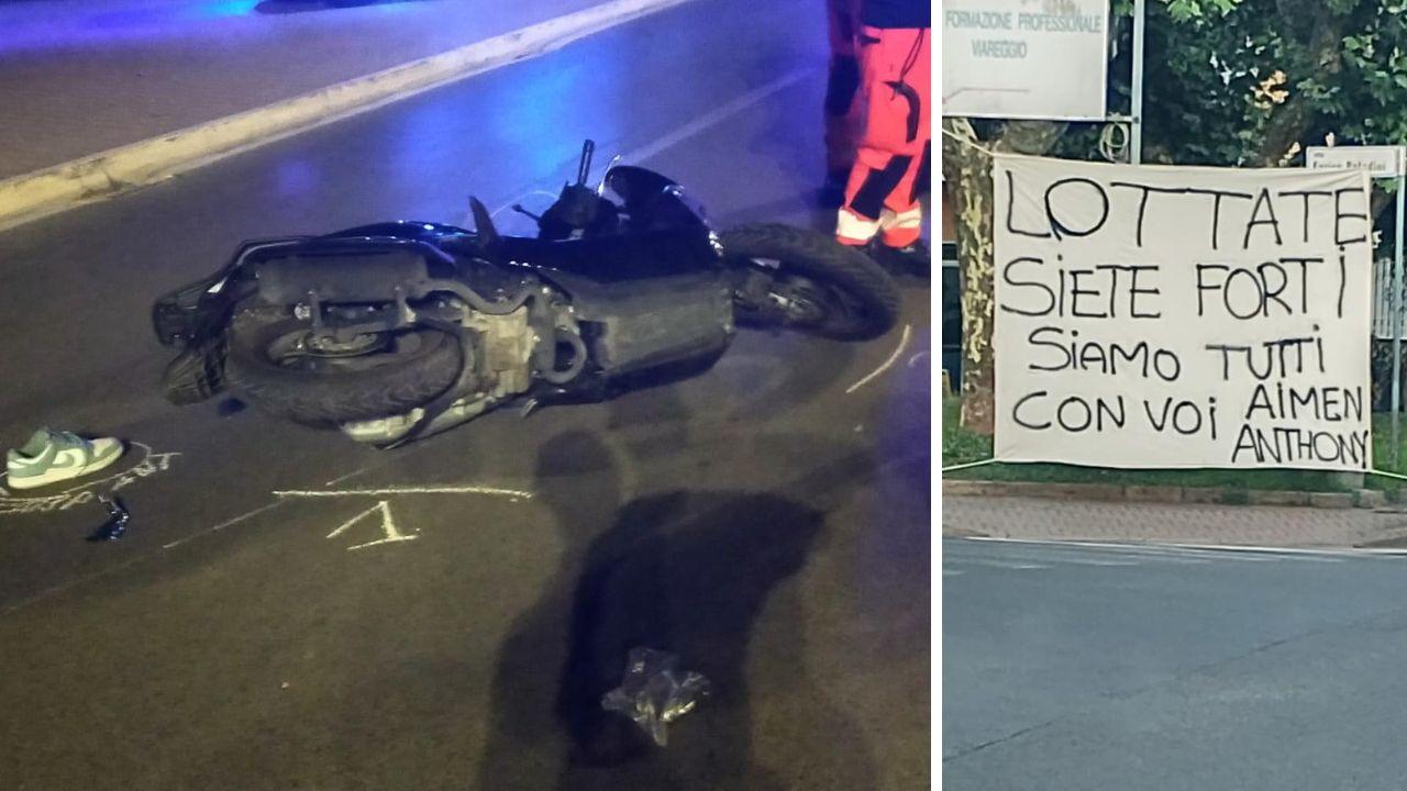 Lo scooter a terra dopo l'impatto e lo striscione di sostegno per i due ragazzi
