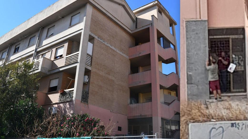 Il palazzo di viale Aldo Moro e due uomini che tentano l'accesso nella struttura