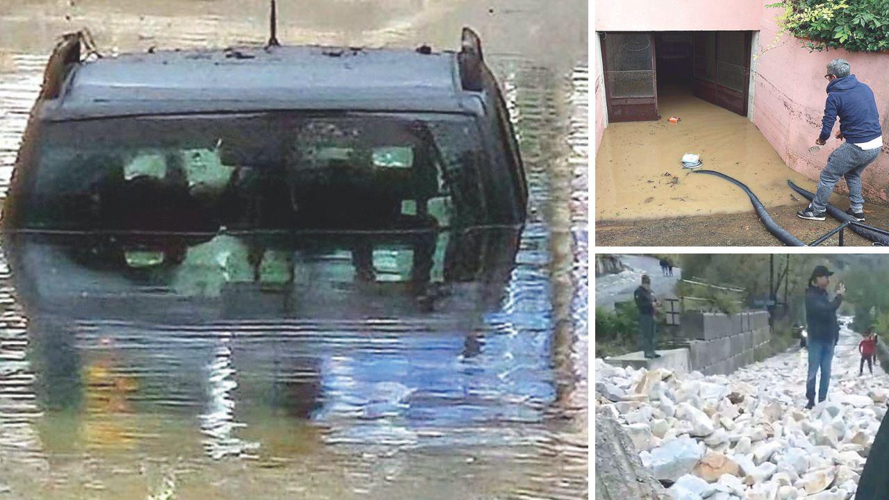 Una macchina rimasta sott’acqua nel sottopasso di via Olivetti, un garage allagato e il ravaneto crollato (foto Cuffaro)