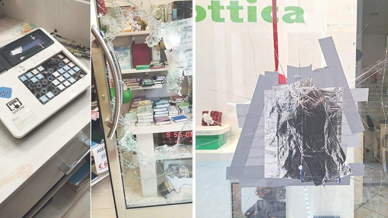 I danni alla cartoleria e la vetrina danneggiata all'Ottica