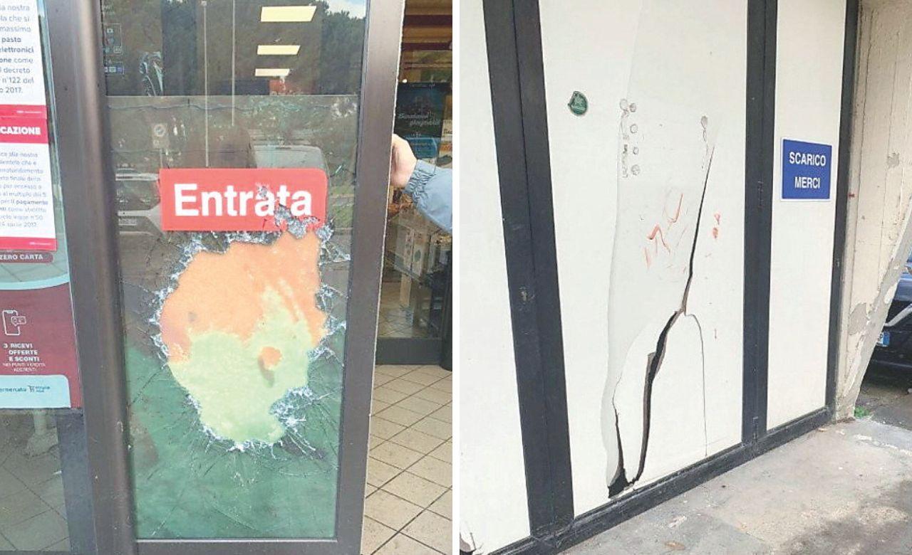 La porta sfondata e la vetrata danneggiata