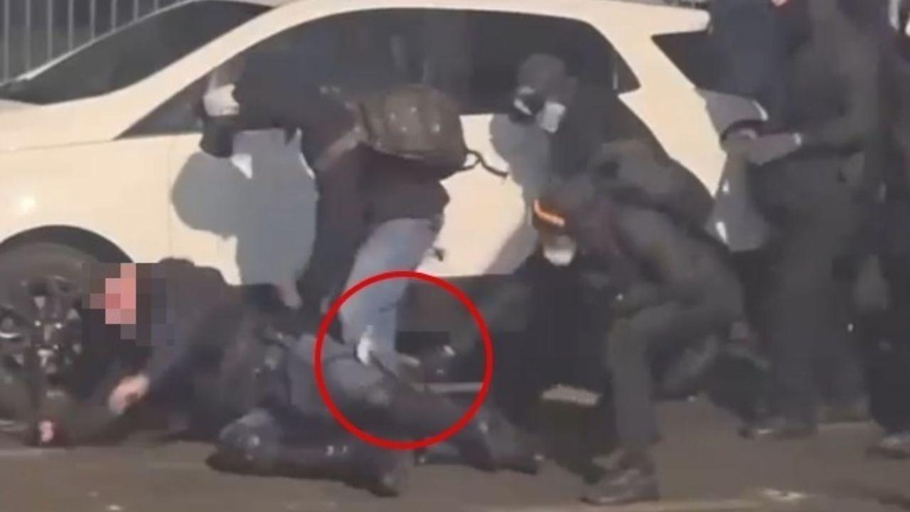 Un fermo immagine del video che mostra l'aggressione al poliziotto a Torino