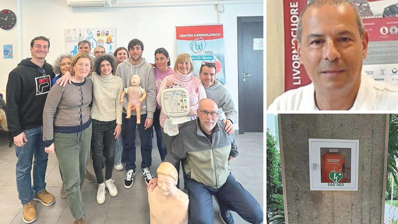 I condomini di viale Sauro 75 e 77 che hanno partecipato al corso per l’uso del Dae, a dx il cardiologo Umberto Baldini e il defibrillatore di viale Sauro