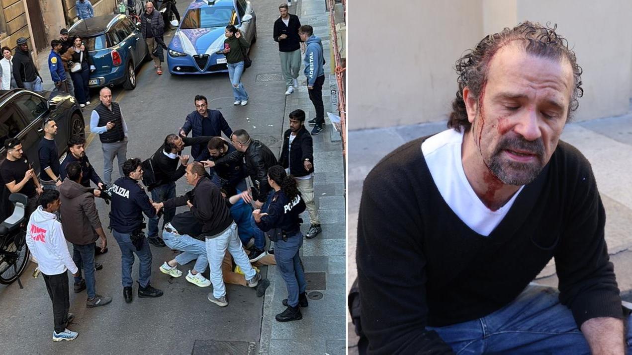 L'uomo bloccato in rua Pioppa, a destra Luca Signorelli (foto di Luigi Esposito)