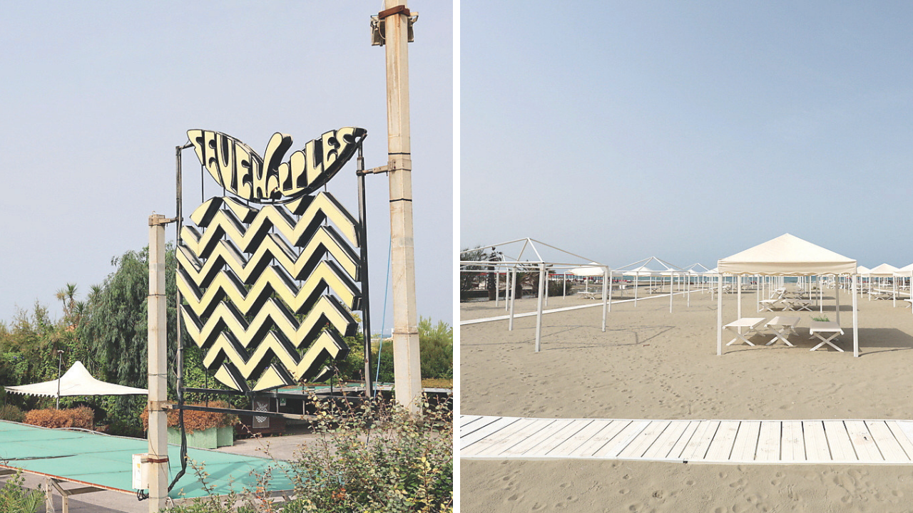 
	La mitica mela simbolo del Seven Apples (foto Iacopo Giannini), a dx lo stabilimento balneare

