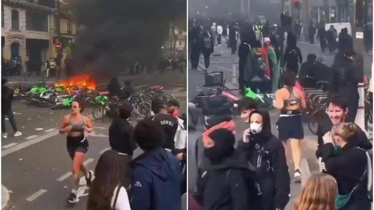 Guerriglia urbana, in una Parigi in fiamme una donna non rinuncia al jogging: il video surreale