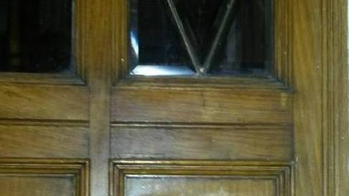 Vandali in azione al Carani: scritte sul portone del teatro