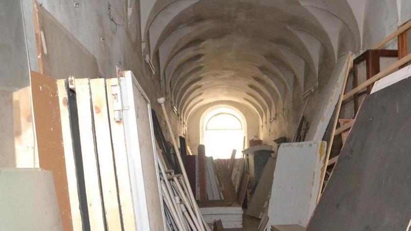 Botteghe artigianali e museo della basilica nel Real Collegio