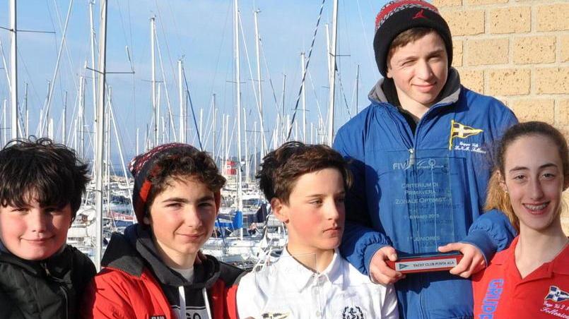 Tre portacolori della Lni Follonica al campionato italiano Optimist a Dervio