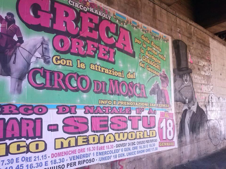 Street art coperta dal manifesto pubblicitario di un circo