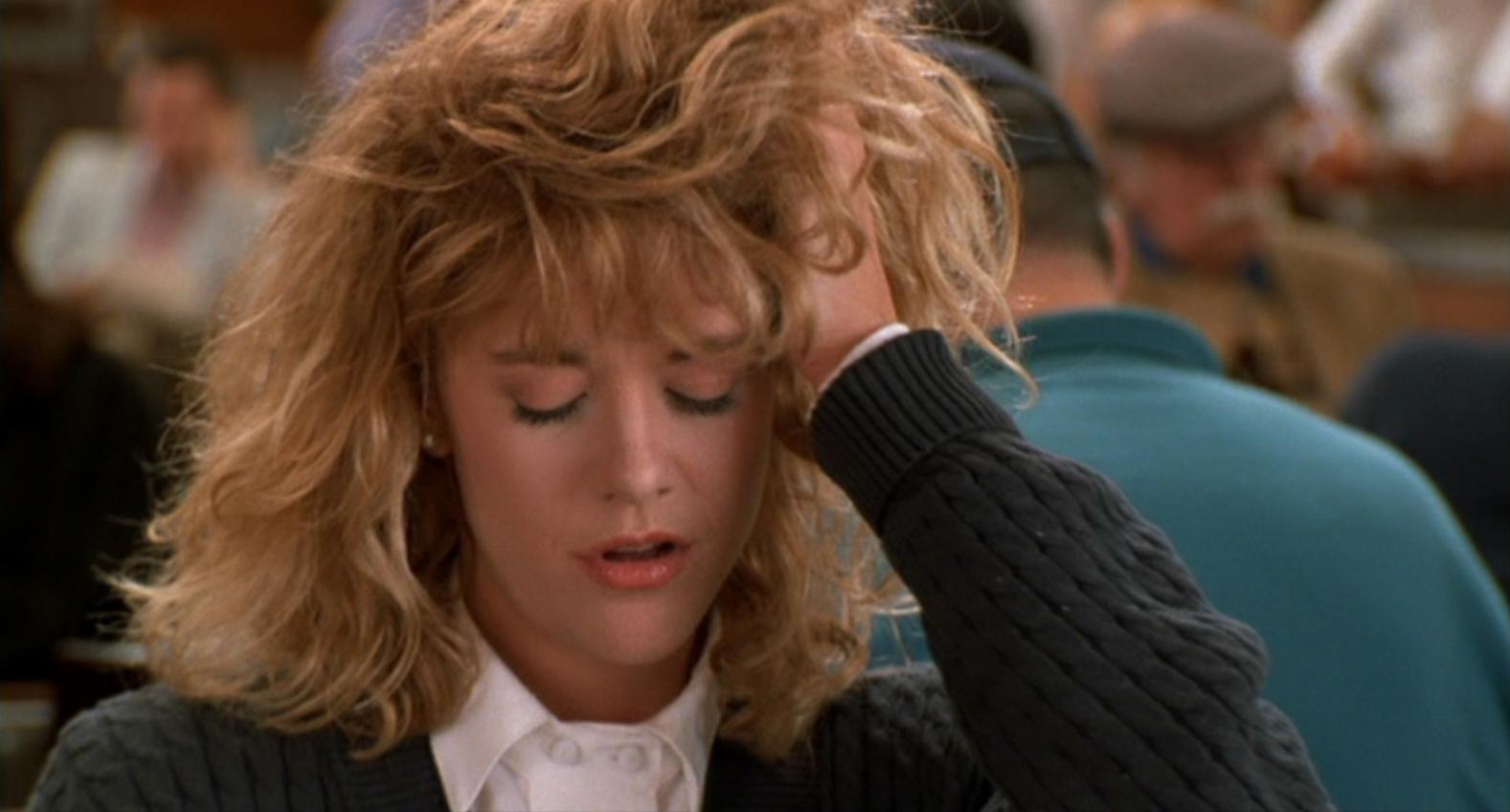 Meg Ryan nel film "Harry ti presento Sally" mentre mima un orgasmo