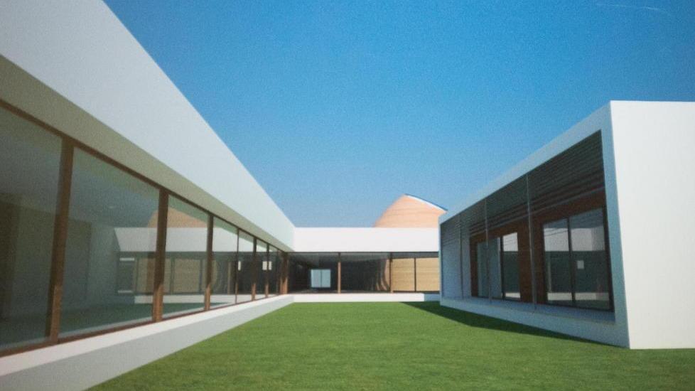 Il rendering dello spazio verde esterno della futura scuola