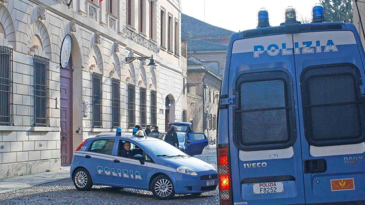 La polizia davanti alla questura di Ferrara