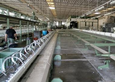 Al lavoro in una filatura    