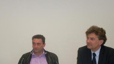 La platea del seminario organizzato da Confesercenti e, sopra, Maurizio Innocenti e Giulio Sbranti