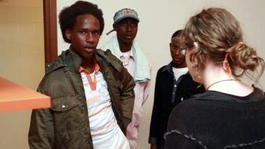 Tre dei profughi accolti in città con una operatrice