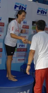 Alice Nesti premiata ai campionati italiani A sinistra Alice a 12 anni e l’allenatore Lombardi