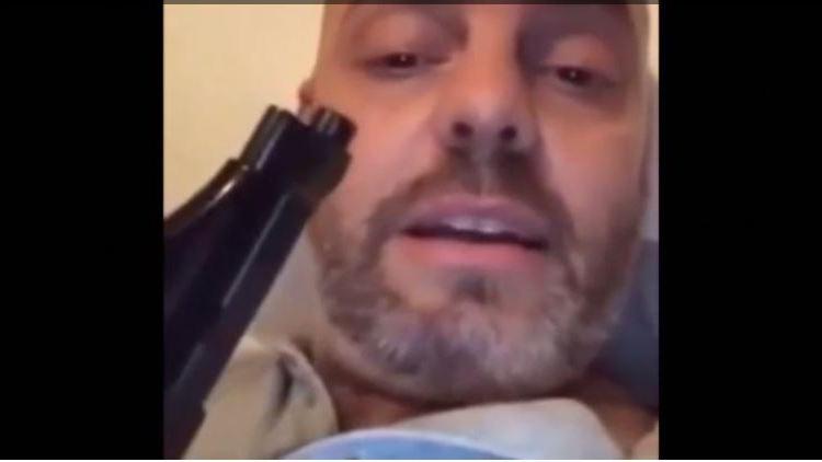 Stefano Solaroli nel video con la pistola