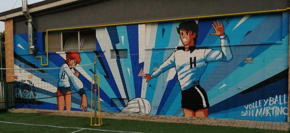 Mila e Shiro nel murales sulla Bombonera di San Martino in Rio