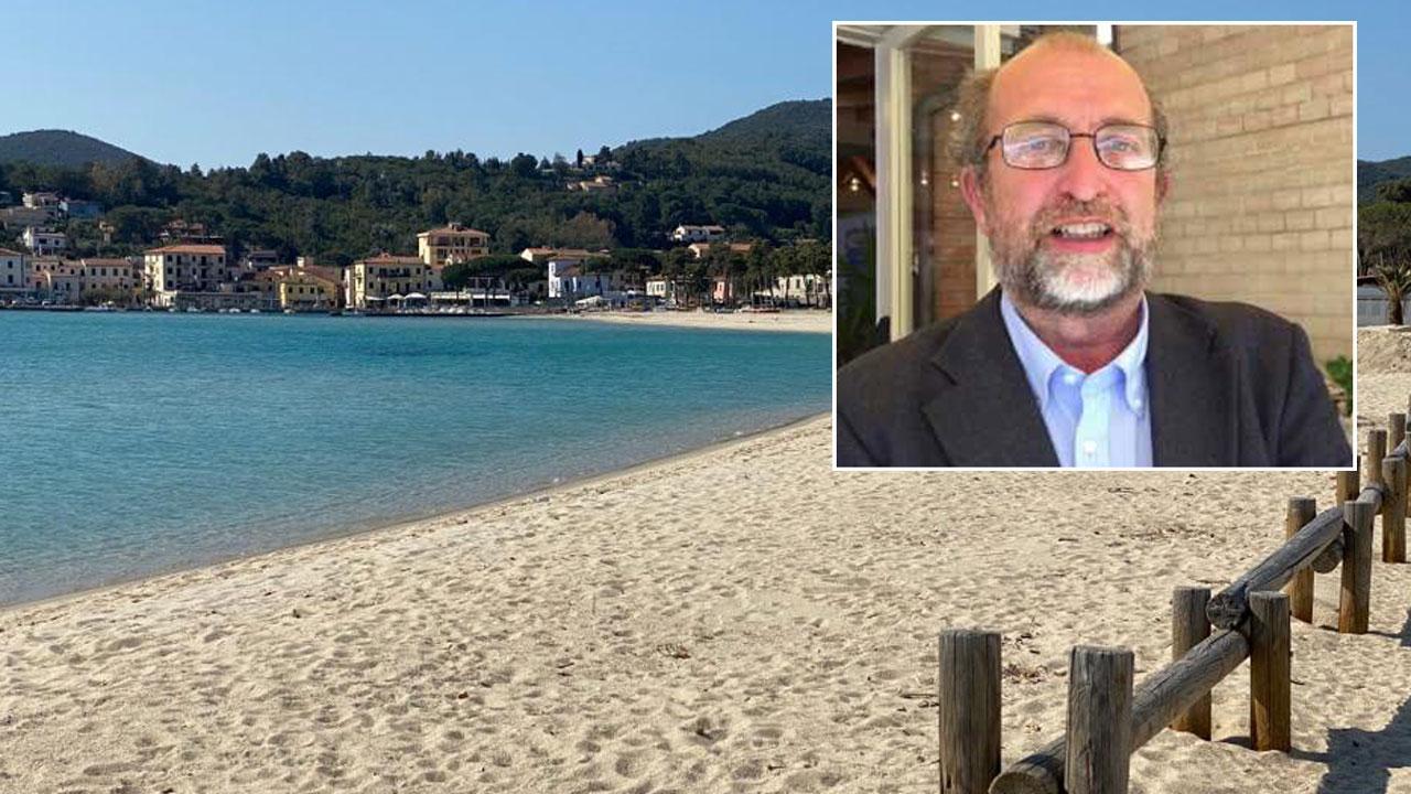La spiaggia di Marina di Campo completamente deserta, nel riquadro Claudio Della Lucia, coordinatore della Gestione associata per il turismo
