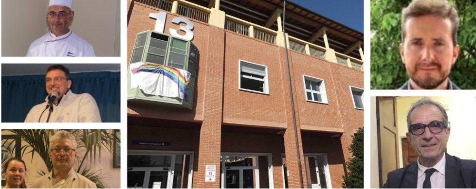 Uno striscione arcobaleno fuuori da Cisanello e, a destra, in alto Federico Benacquista e sotto Antonio Veronese