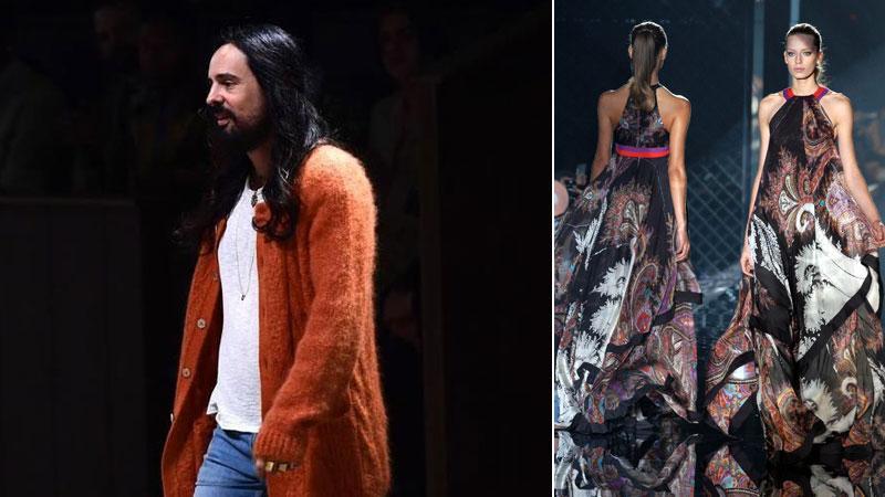 Il direttore creativo di Gucci, Alessandro Michele e accanto due modelle sfilano sulla passerella