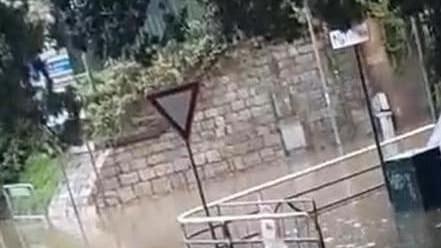 Pioggia e grandine sottopasso allagato