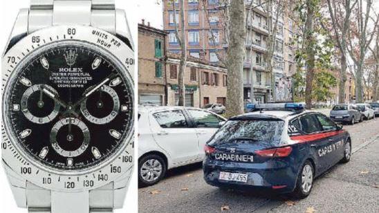 Il modello di Rolex oggetto di furto e un'auto dei carabinieri